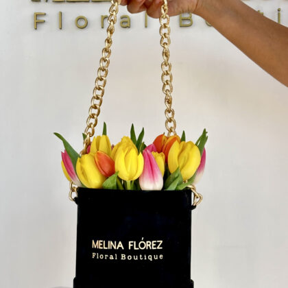 Small black velvet box with a golden top with multicolored tulips, they are a Top! Of elegance and discretion.